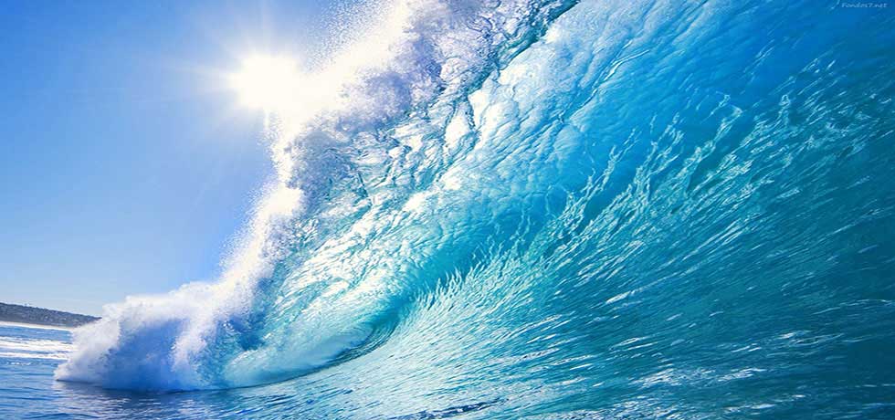 Blue tidal wave with sunbeam shining through